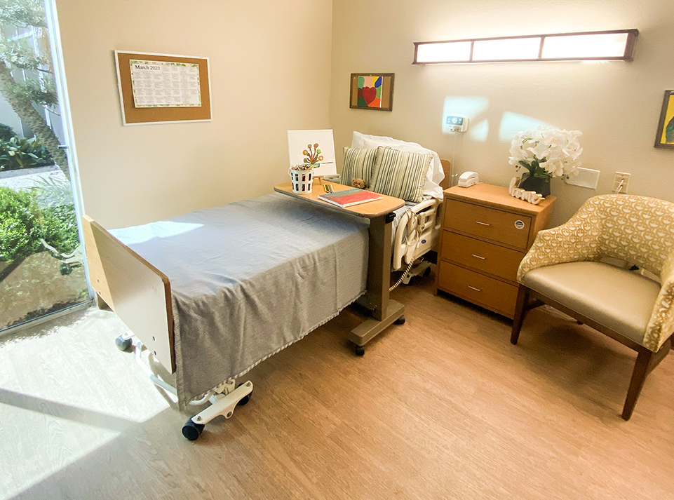 care center room with bed and chair 
