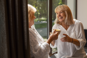 Senior Conversation Starters. Woman talks to senior woman.