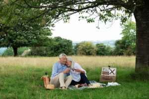 Man and woman enjoy picnic outdoors