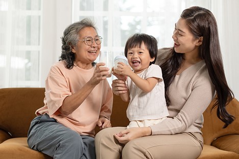 Intergenerational Activities. Woman, son, and grandmother play together.