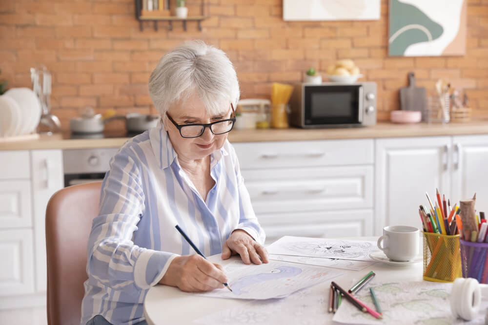 Coloring is a good craft for seniors with arthritis.