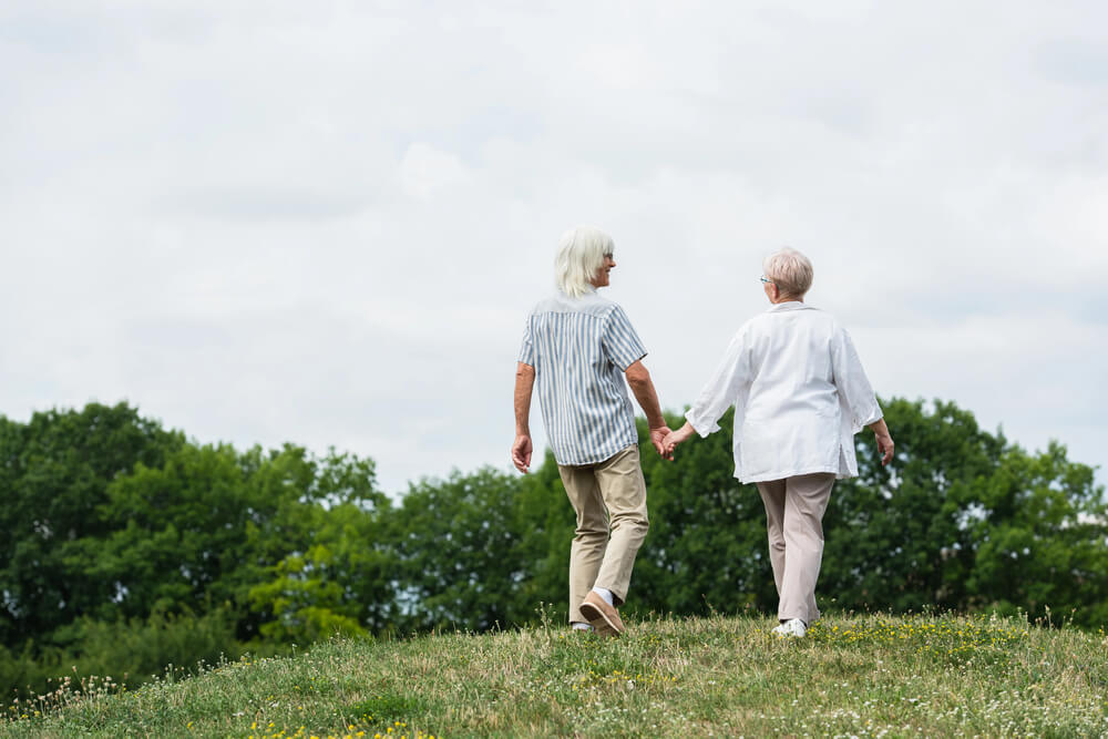 Increased balance from walking over uneven terrain is one of the health benefits of outdoor activities for seniors​.