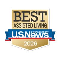 Gold and blue badge displaying "Best Assisted Living 2026" from U.S. News & World Report, highlighting excellence in Camarillo senior living.