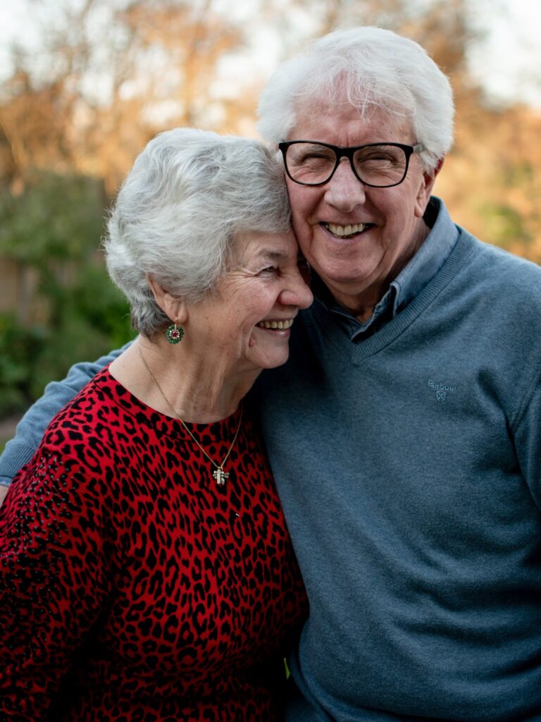Elderly man and woman laughter. Image Source: www.unsplash.com